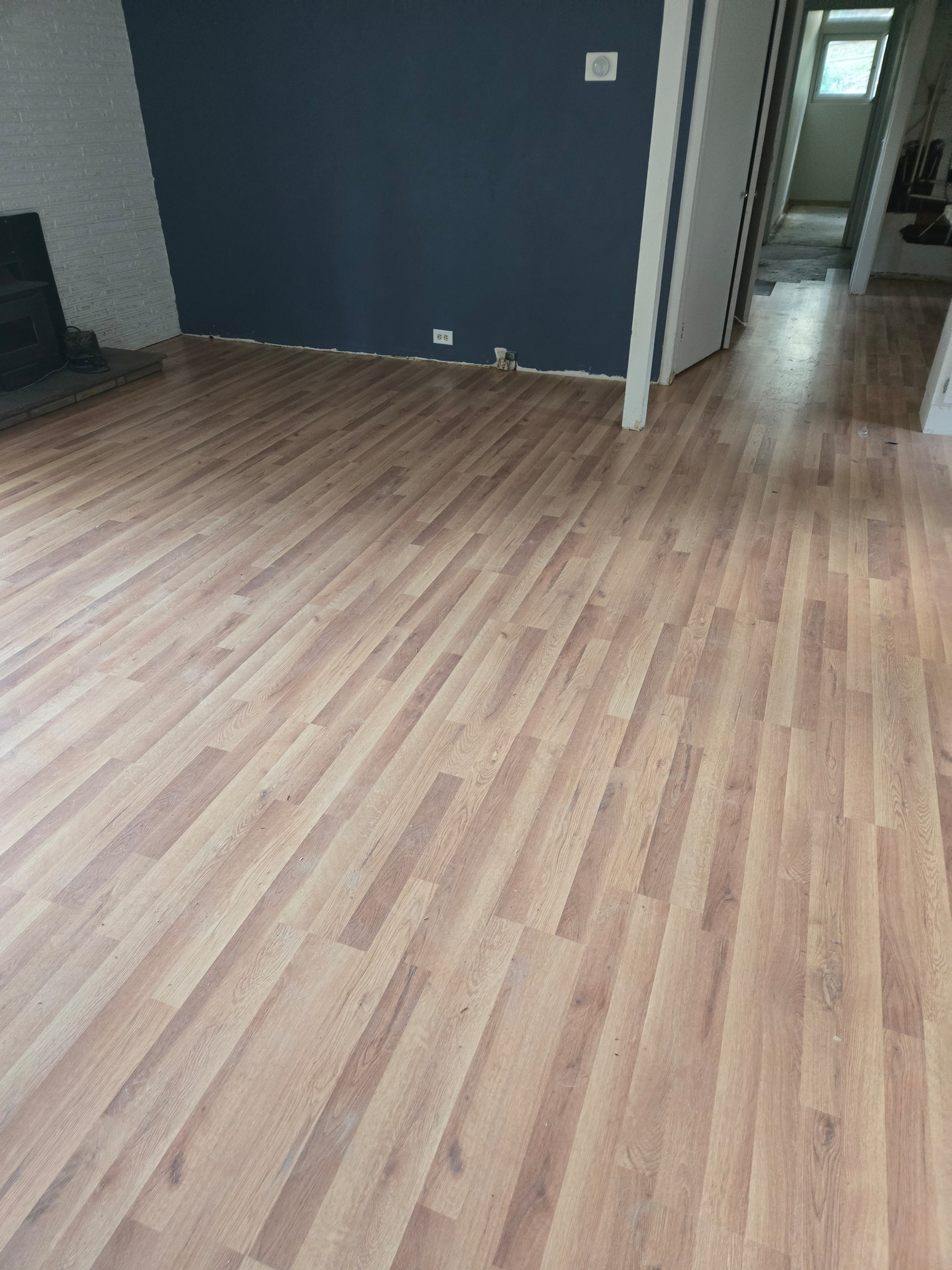 Oak laminate flooring installed in the living and dining room.